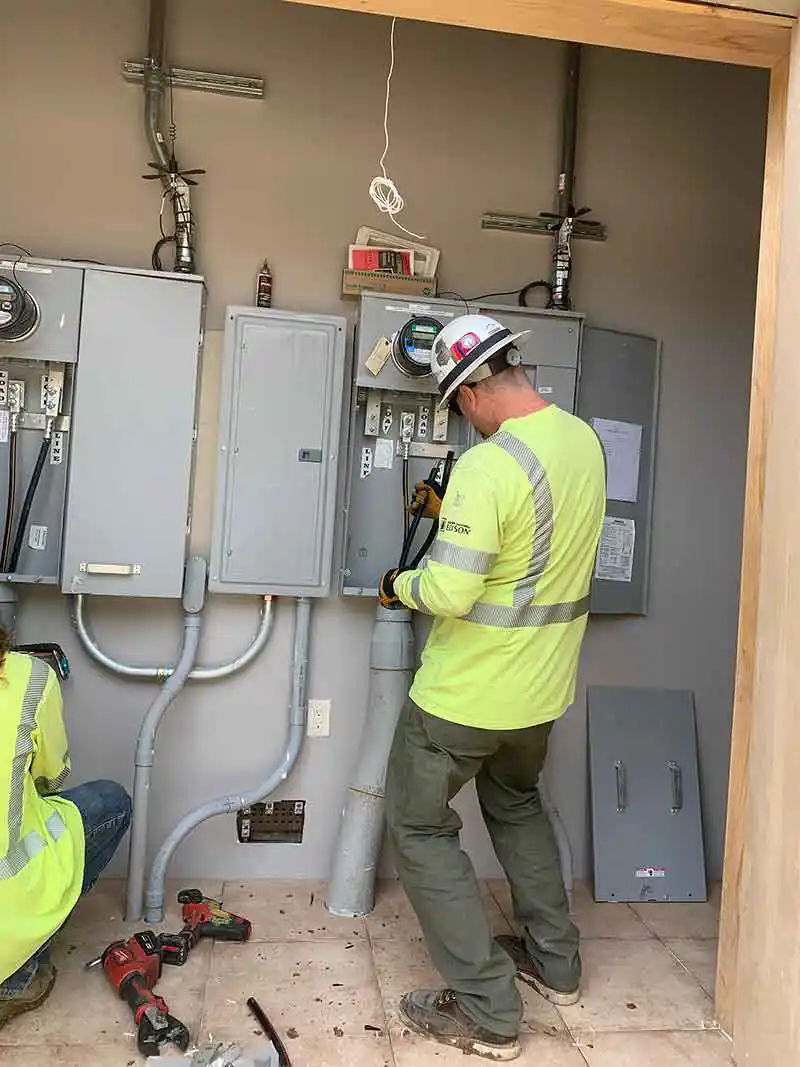 Licensed electrician performing residential electrical panel upgrade in Southern California