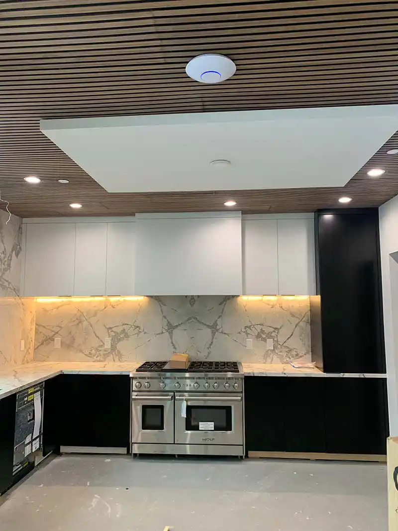 Luxury kitchen lighting design and installation with recessed and pendant fixtures in Los Angeles