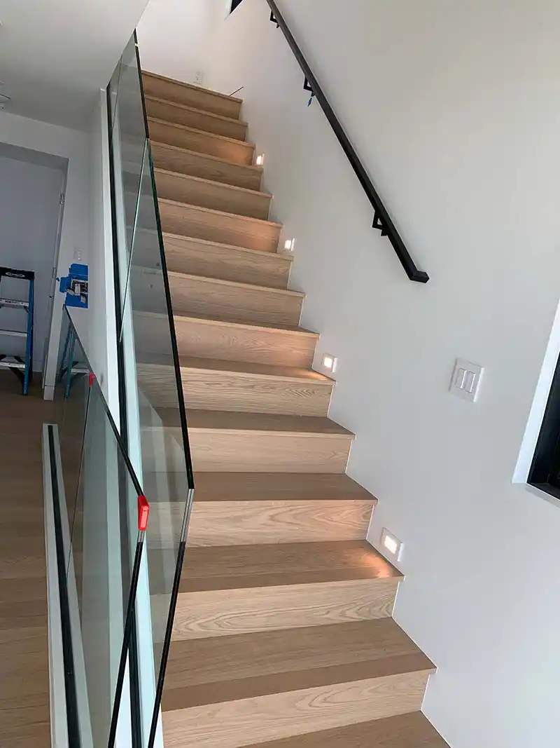 Modern staircase LED step lighting installation for luxury home in Southern California