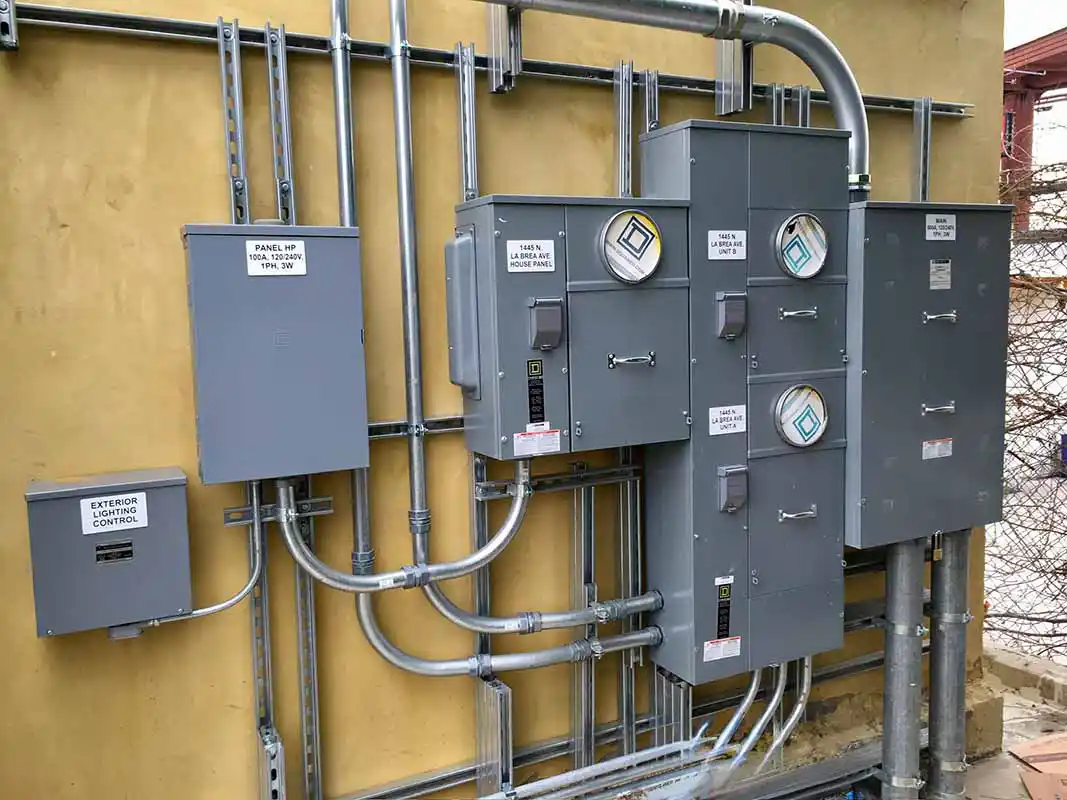 Outdoor electrical conduit and lighting control panel installation in Southern California
