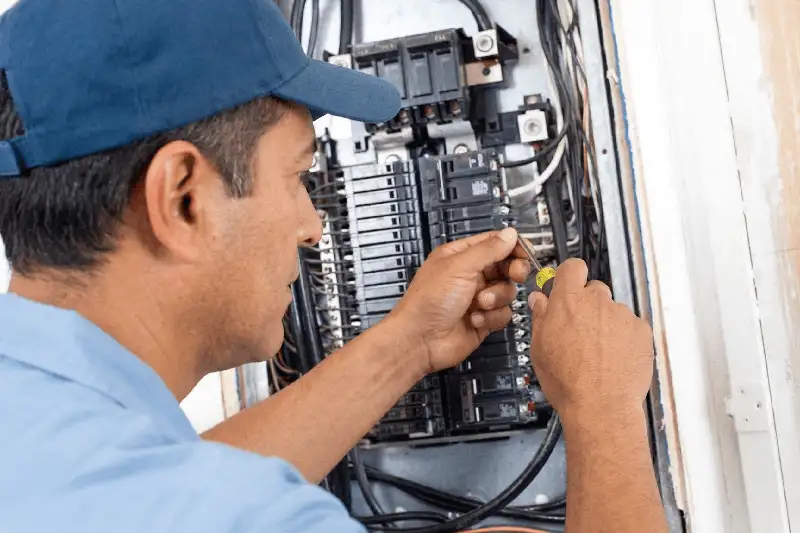Licensed electrician performing an electrical panel upgrade in Los Angeles County